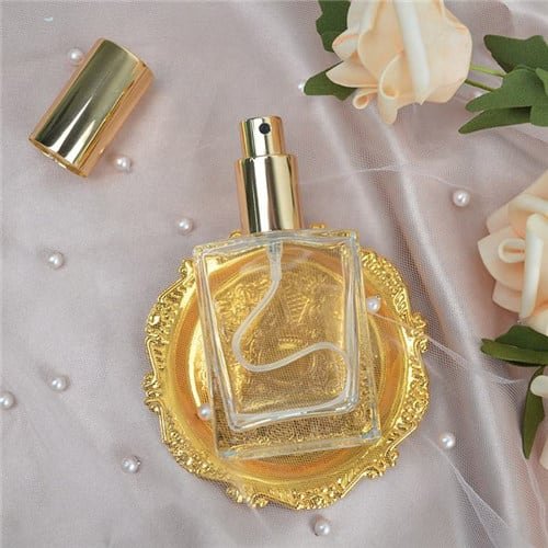 Alt_ small glass fragrance bottle in gold case